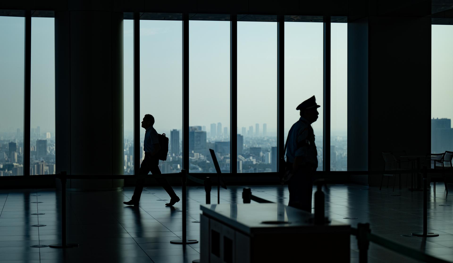 Global Photography Awards Winner - The Commuter and the Guard